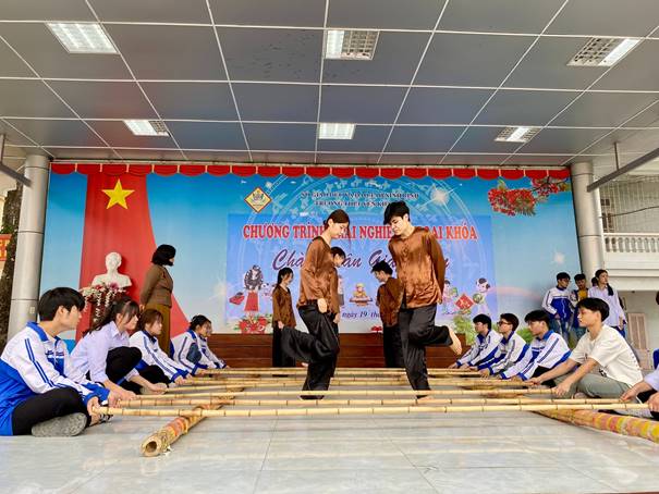 Description: A group of people performing on stage Description automatically generated