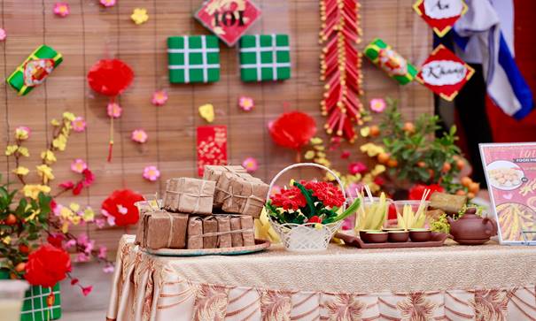 Description: A table with food and flowers Description automatically generated